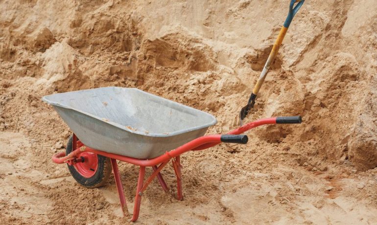 Moving sand by hand